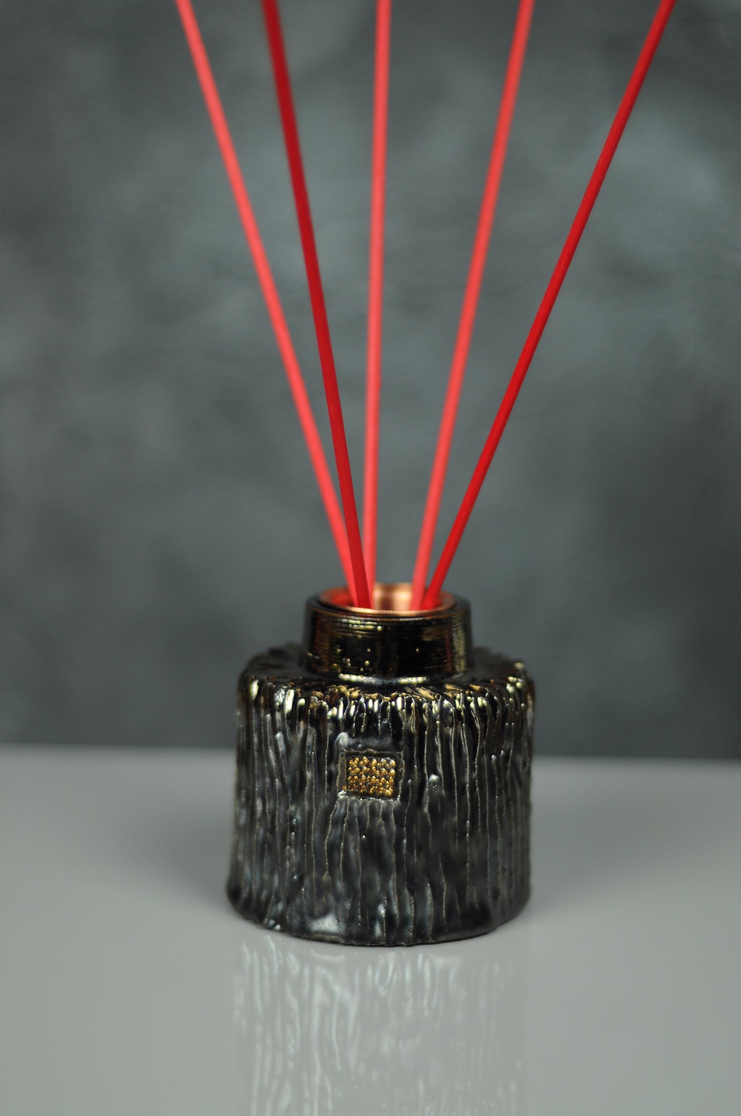 Ceramic reed diffuser in golden color with faux diamond pave