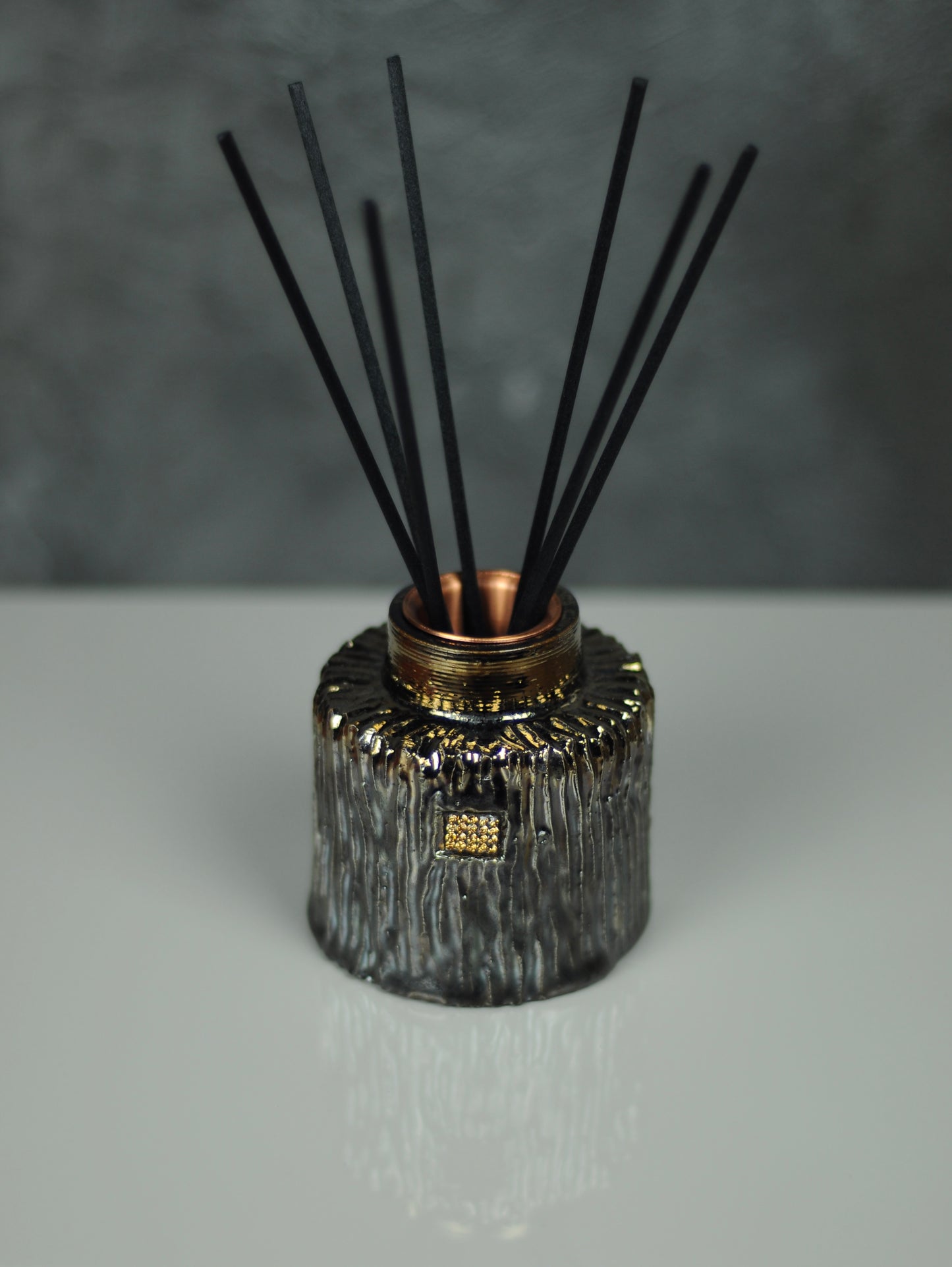 Ceramic reed diffuser in golden color with faux diamond pave